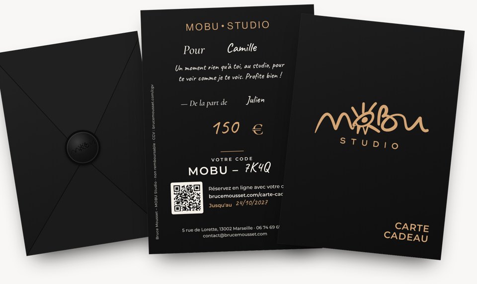 MOBU Studio black and gold gift card, front and handwritten back, with its black envelope closed with a wax seal